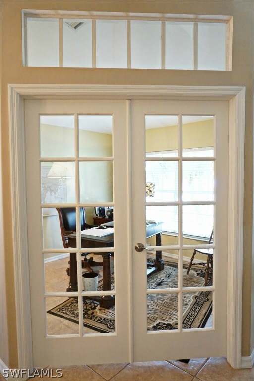 French Doors & Transom Window to Den