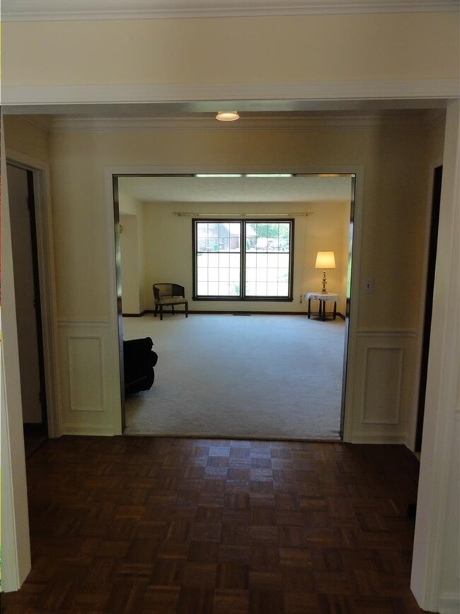 The classic foyer, with parquetry wood floors and 
