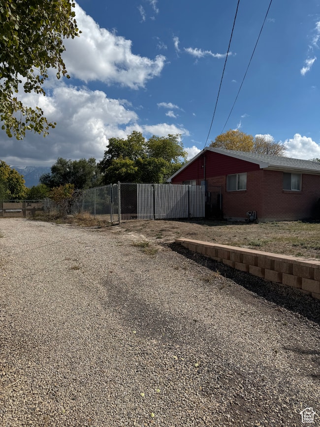 View of yard featuring a gate