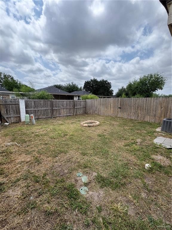 View of yard featuring central AC unit