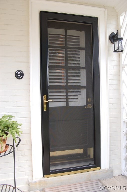Kitchen door with screen opens to pool area.