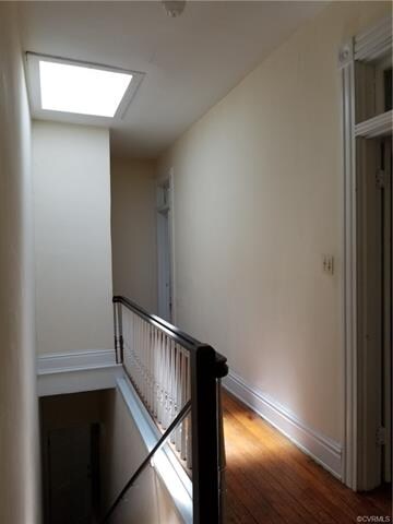 Entrance door is at the bottom of the stairs, A sk