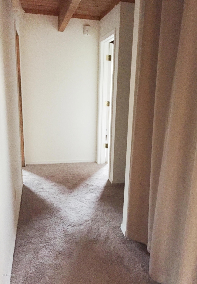 Hallway with carpet