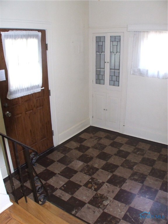 Entry to home with leaded glass built-in and guest