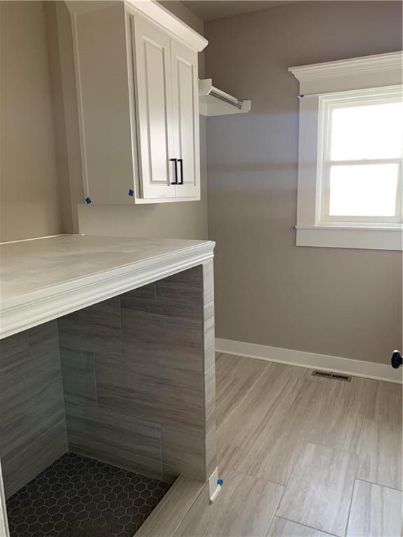Laundry room with doggie shower.