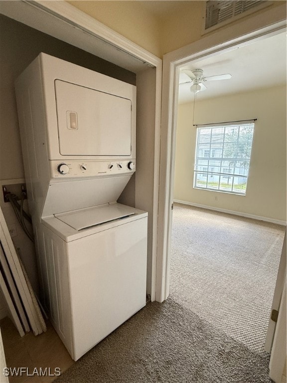 Laundry room with stacked washer / drying machine,