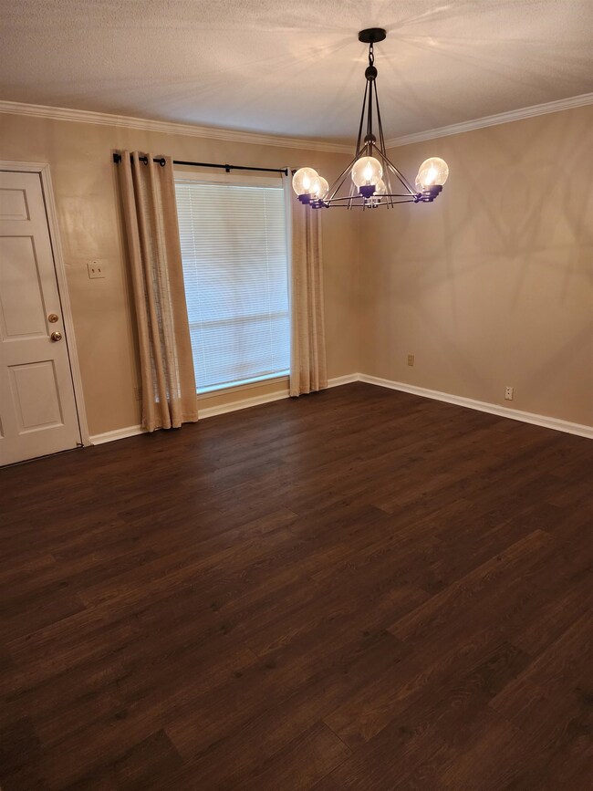 Spare room with a notable chandelier, ornamental m