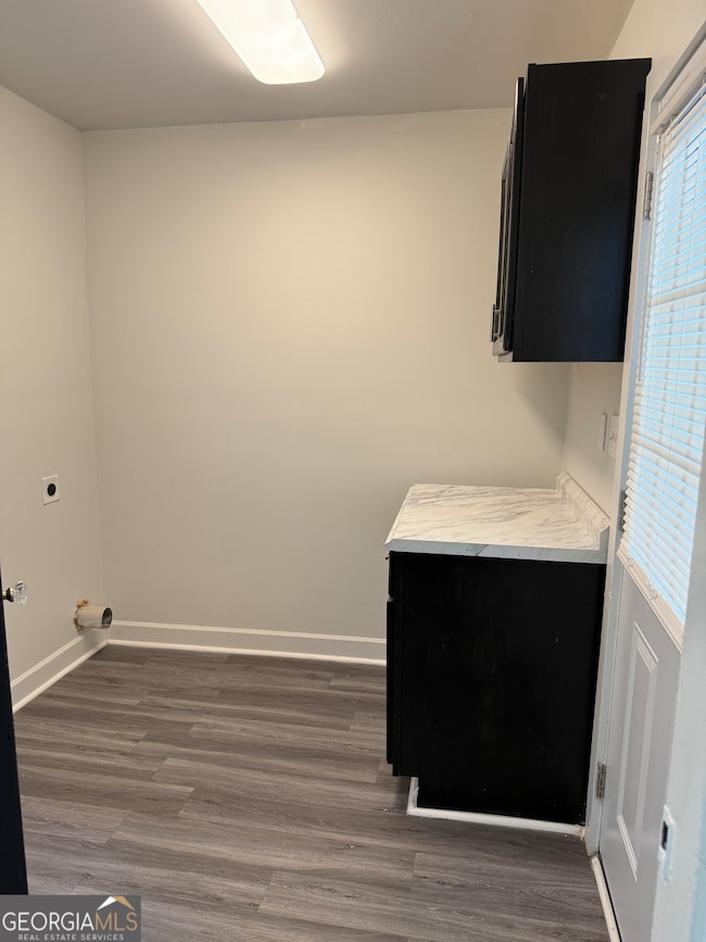 Laundry Room with tankless hotwater heater