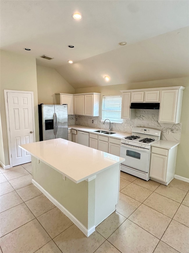 Renovated kitchen bright white quartz with tile ba