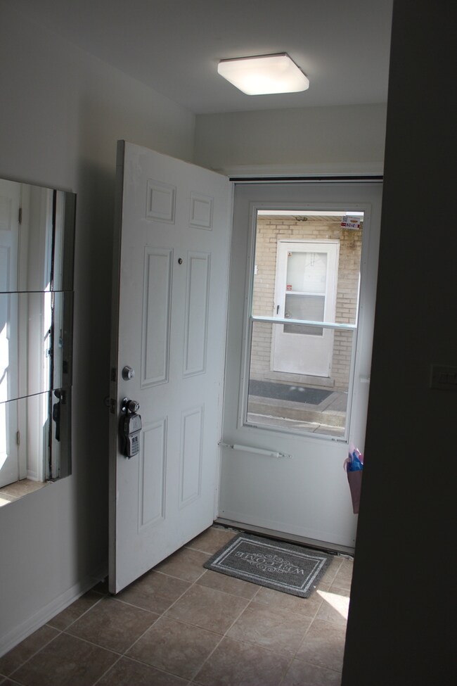 foyer with new porcelain tiles