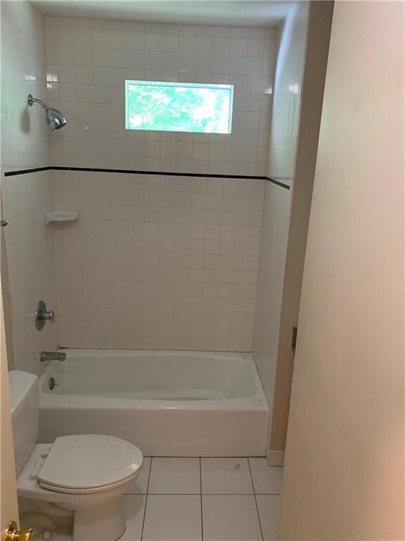 Full bath featuring tile patterned flooring, show