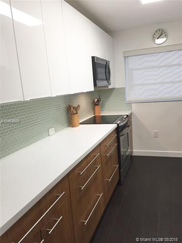 Kitchen completely remodeled with Corian counter t