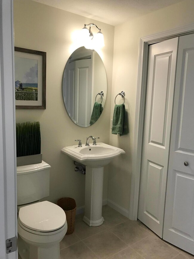 Half bath with side by side washer dryer