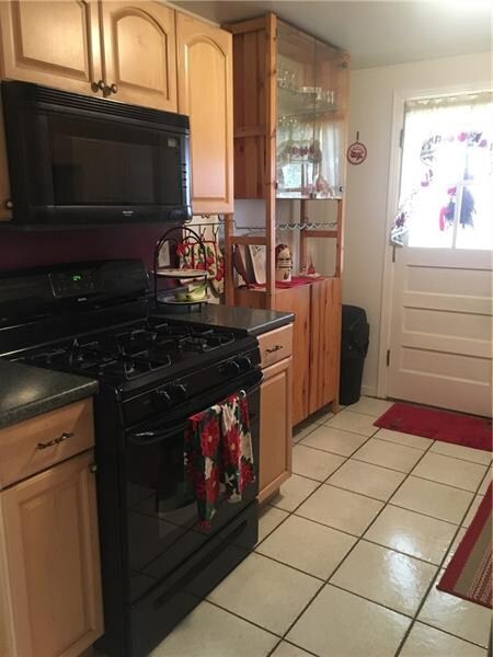 Updates and storage are maximized in this kitchen.