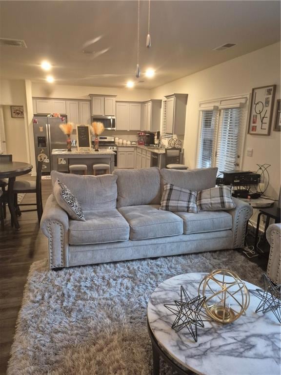 Living room featuring dark wood finished floors