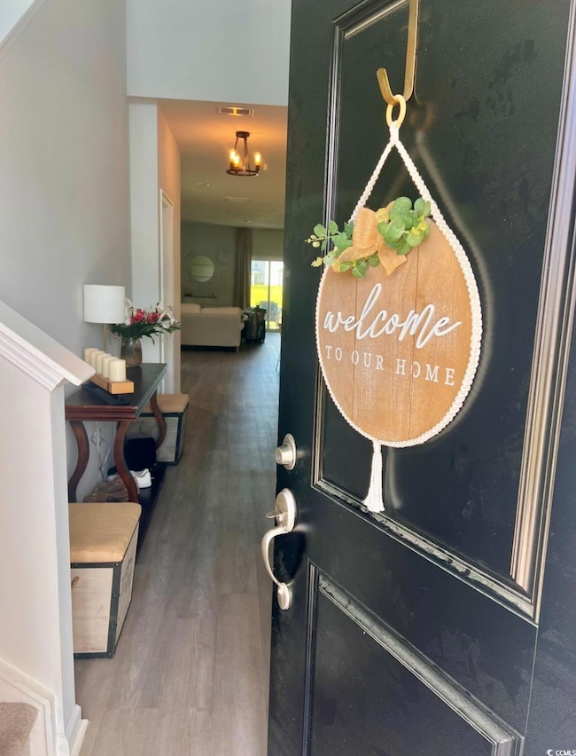 Entryway featuring wood finished floors