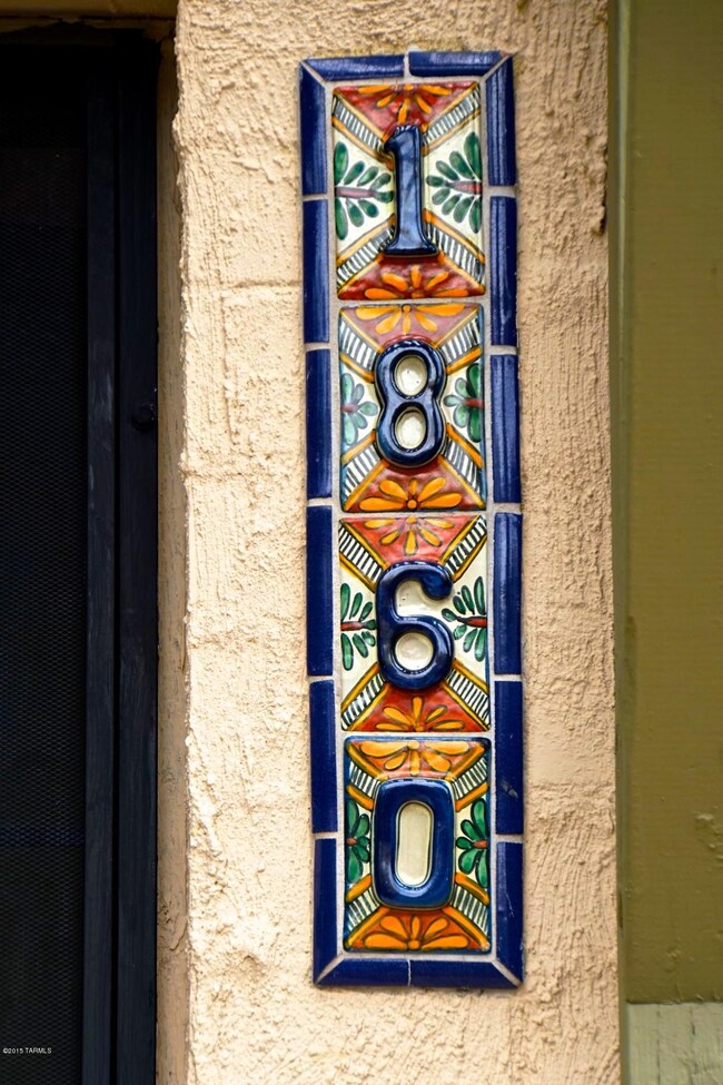 Pretty address tiles by front door