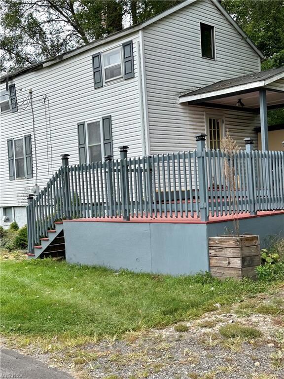 Rear view of house with a deck