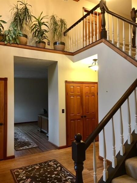 Staircase to Upper Foyer and Bedrooms Featuring Le