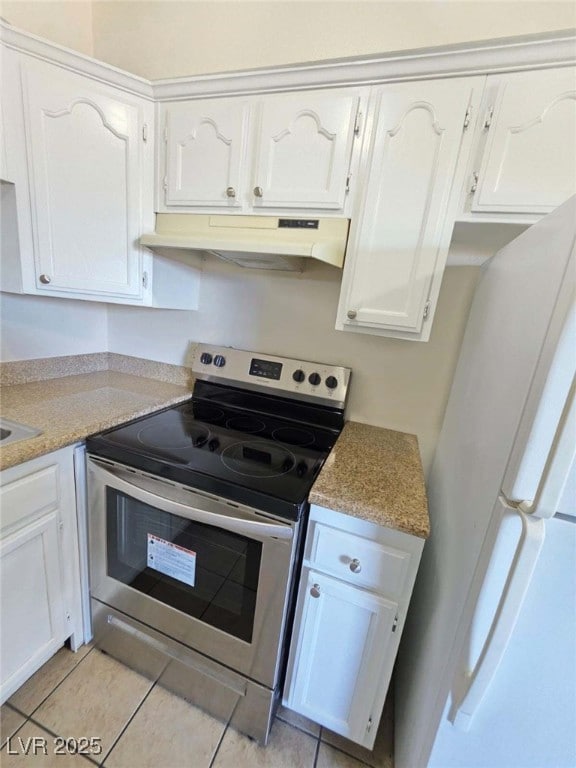 Kitchen featuring stainless steel range with elect