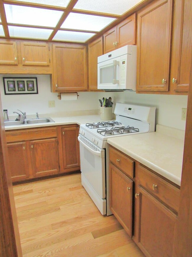 Another view of the kitchen with updated hardwood 