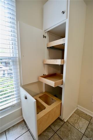 Pantry cabinet has pull out trash & recycle + pull out shelving