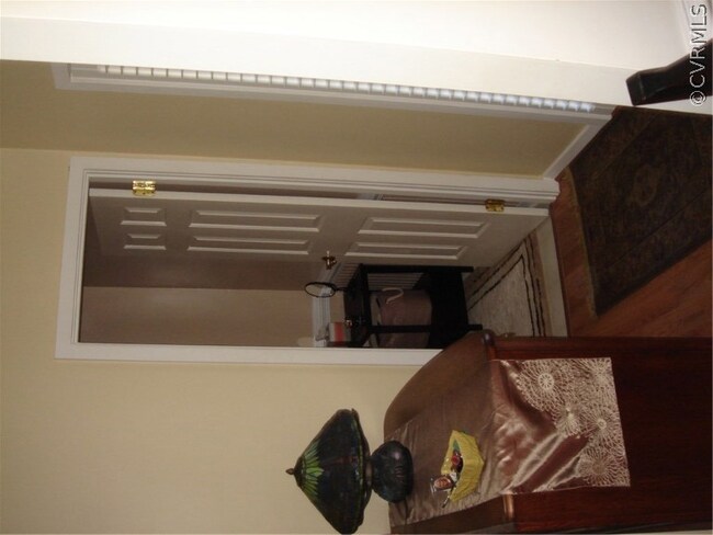 Front hallway looking into hall half bath