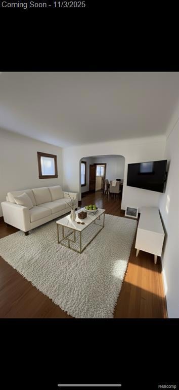 Kitchen featuring light countertops, black electric range oven, dark wood-style floors, and open shelves