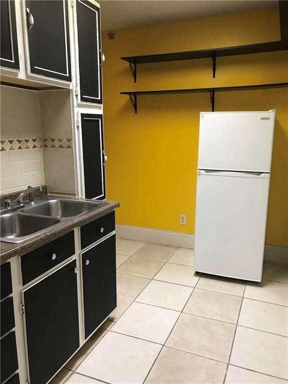 Upstairs kitchen offers a gas stove, disposal, mic