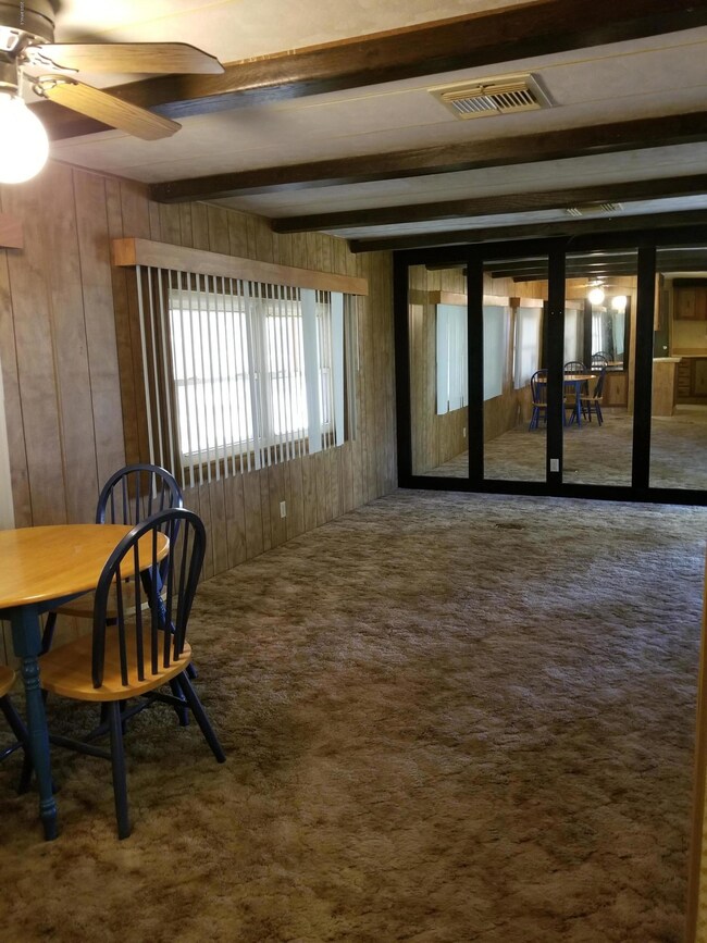 Living room with wall of mirrors