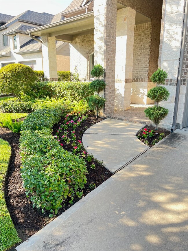 Pathway that leads to front porch and home entry.
