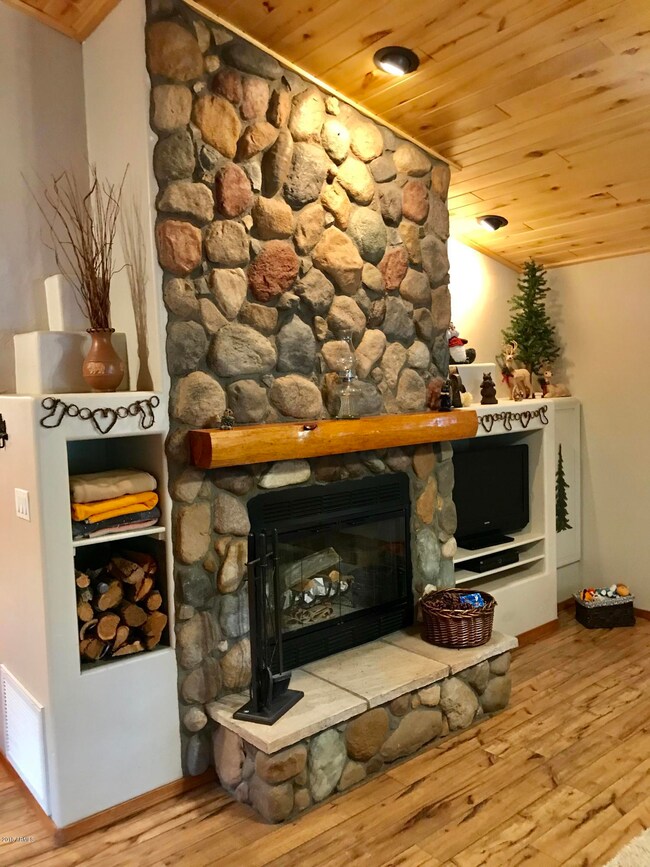 FLOOR TO CEILING STONE FIREPLACE