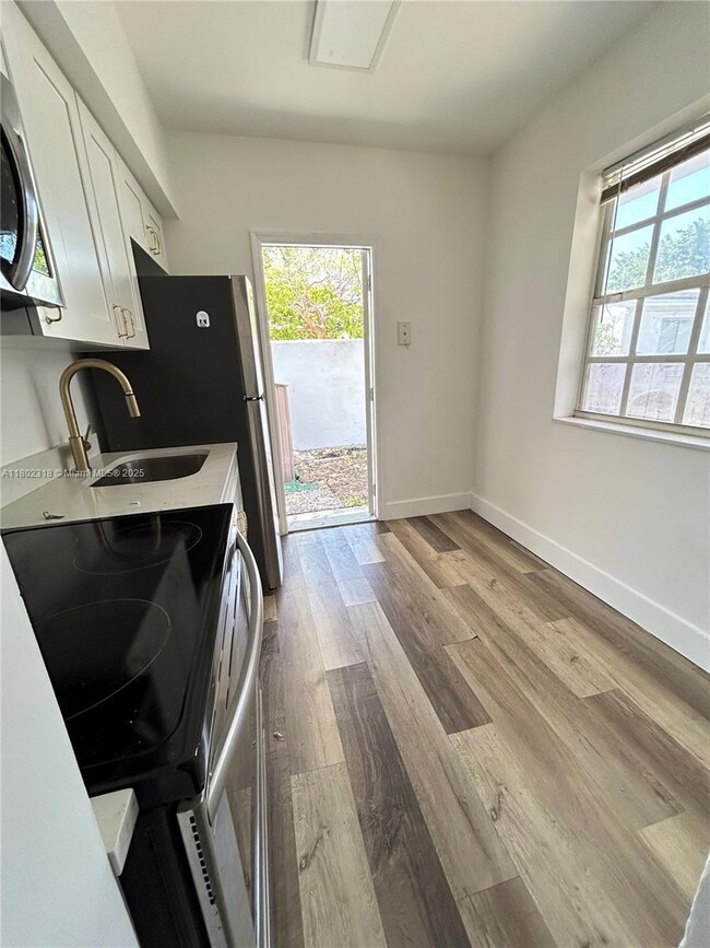 Kitchen with access to private backyard