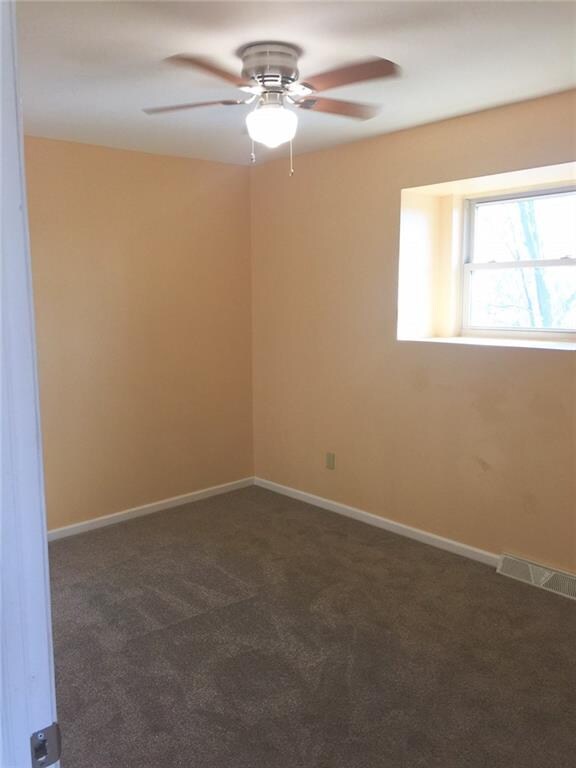 Bedroom: This 12x10 bedroom off the eat-in kitchen