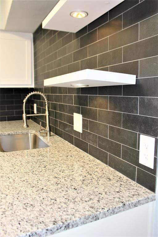Floating shelves with under mount lights.