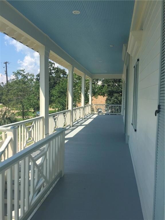 Stunning front porch perfect for rocking chairs or