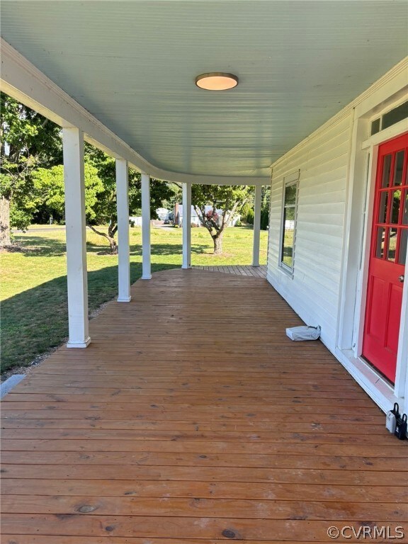 Wooden deck featuring a yard