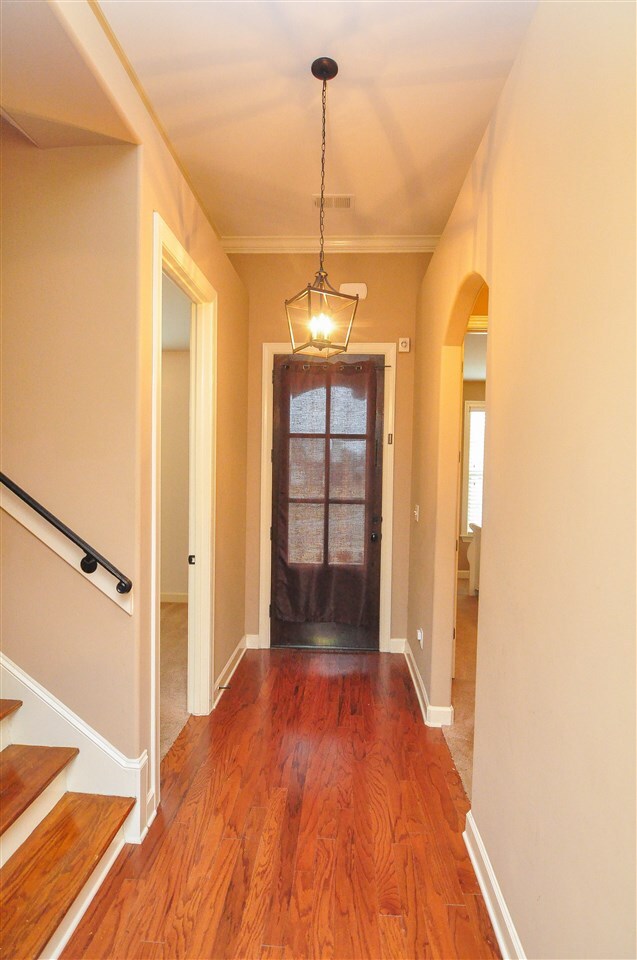 Step inside and be greeted by gleaming hardwood fl