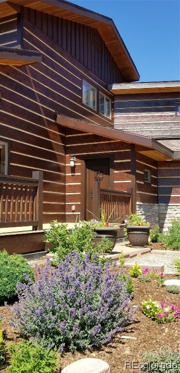 Perennial gardens frame the entrance as you approa