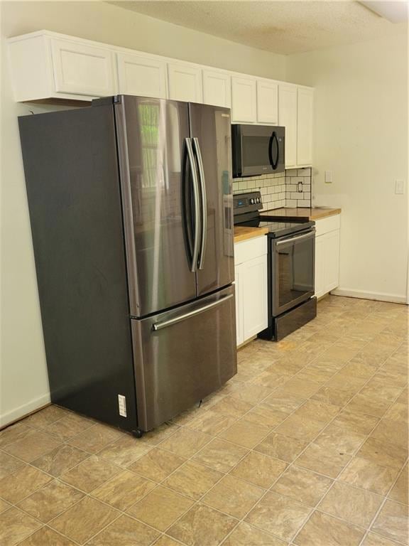 Kitchen featuring range, tasteful backsplash, base