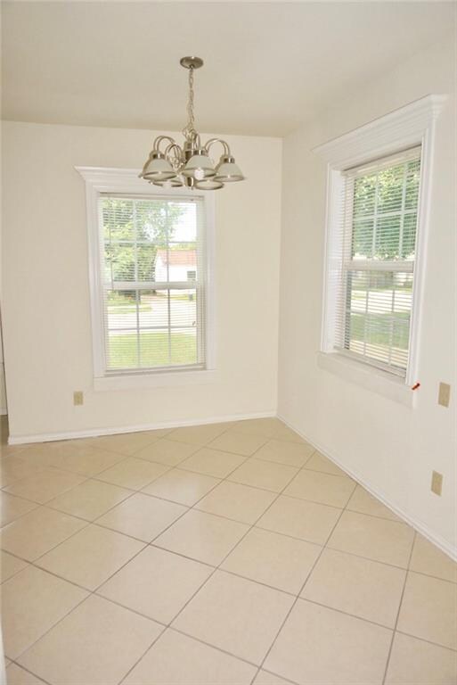 Open-concept dining area off of living room and ki