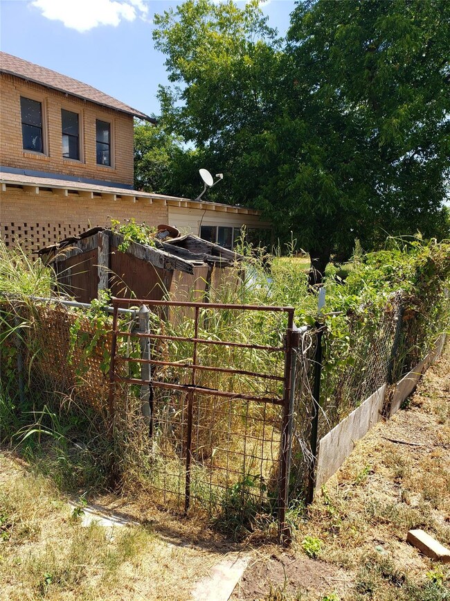Backyard facing the second story of the home.