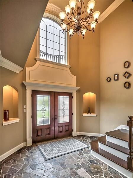 Stone, marble, granite and hardwood join a palette of neutral shades to create the opulent interiors of this Scarlett Ridge masterpiece.