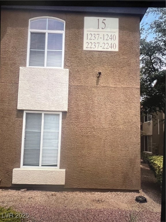View of side of property with stucco siding
