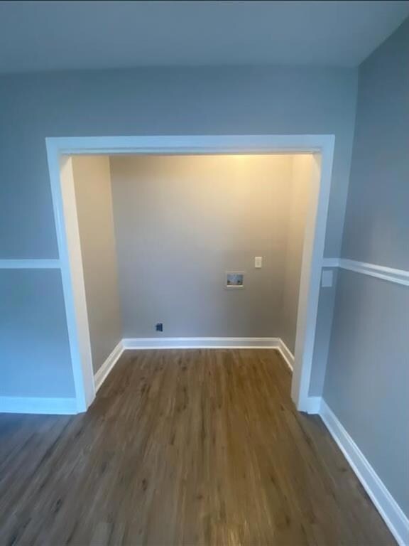 Laundry room featuring dark wood-style flooring and washer hookup