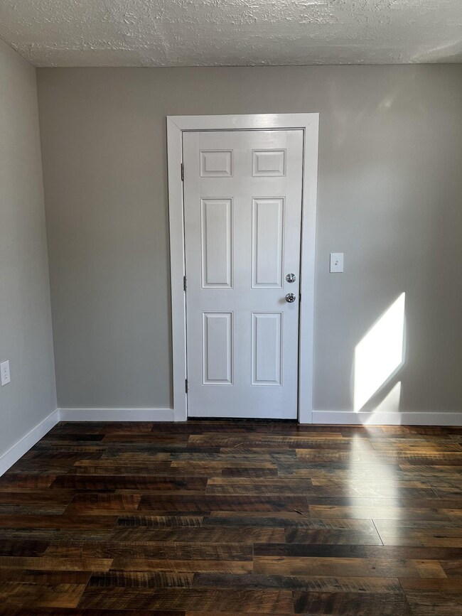 Exterior door leads to the rear of the property. 