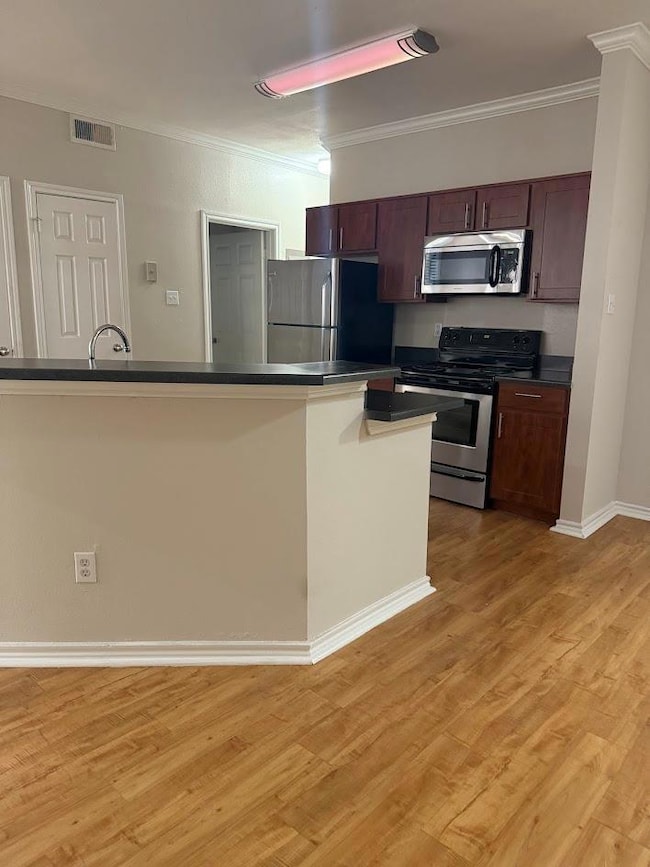 Kitchen featuring appliances with stainless steel