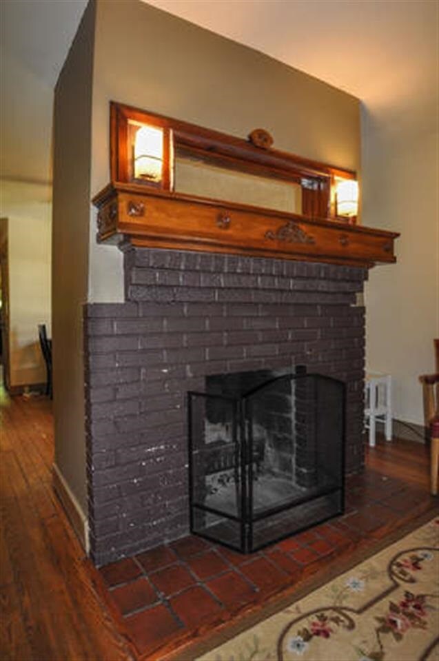 Wood Burning fireplace separates small living room