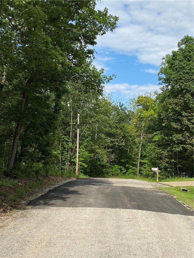 Viewing Rushden Ln. with the Lot straight ahead and just slightly to the Left.