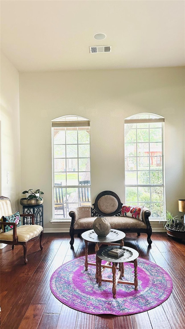 Living area featuring hardwood / wood-style floor